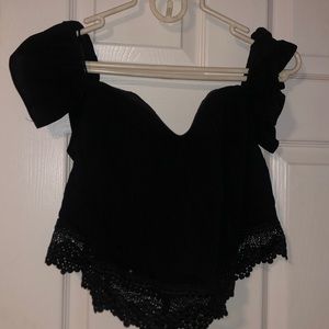 Black off the shoulder crop top. Structured bodice. Never worn.